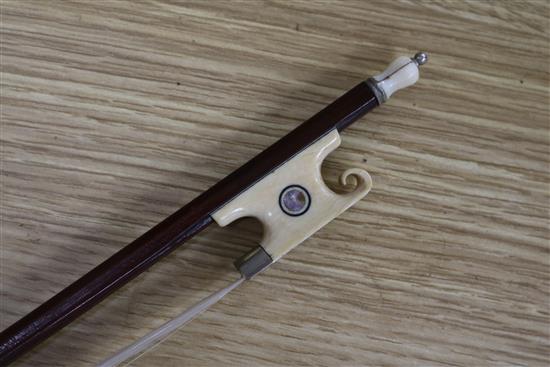 A silver mounted violin bow, an ivory mounted violin bow and a late 19th century German violin, cased